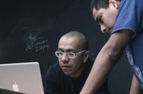 Tutor working directly with students